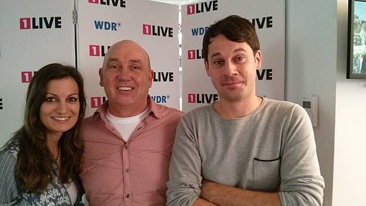 Norbert Schick mit den 1LIVE-Moderatoren Freddie und dem Sassenroth